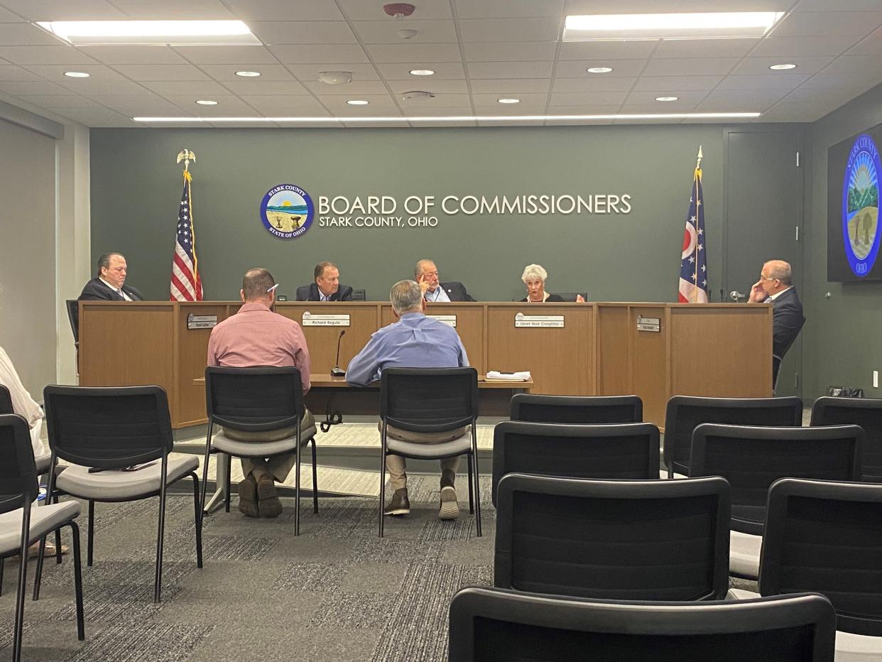 Stark County commissioners listen to a proposal about creating a revolving loan fund during a work session on Monday.