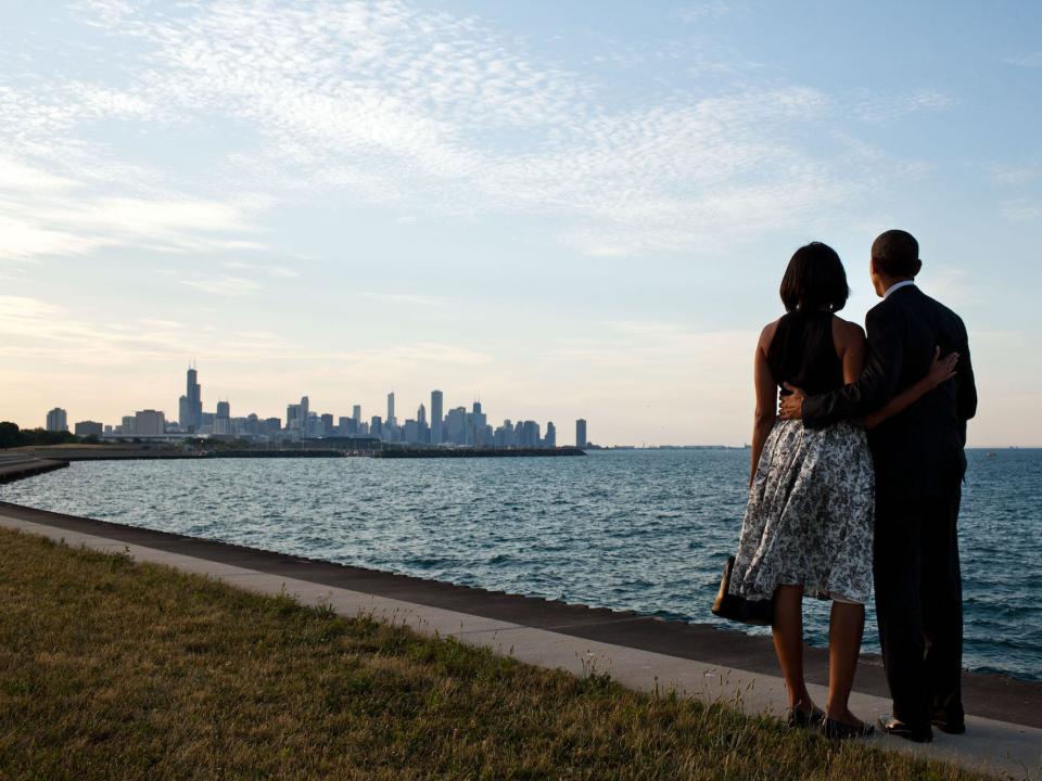 barack and michelle look at a city view