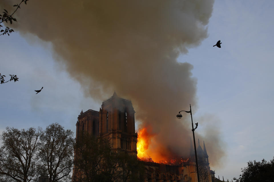 Notre Dame cathedral is burning in Paris, Monday, April 15, 2019. A catastrophic fire engulfed the upper reaches of Paris' soaring Notre Dame Cathedral as it was undergoing renovations Monday, threatening one of the greatest architectural treasures of the Western world as tourists and Parisians looked on aghast from the streets below. (AP Photo/Francois Mori)