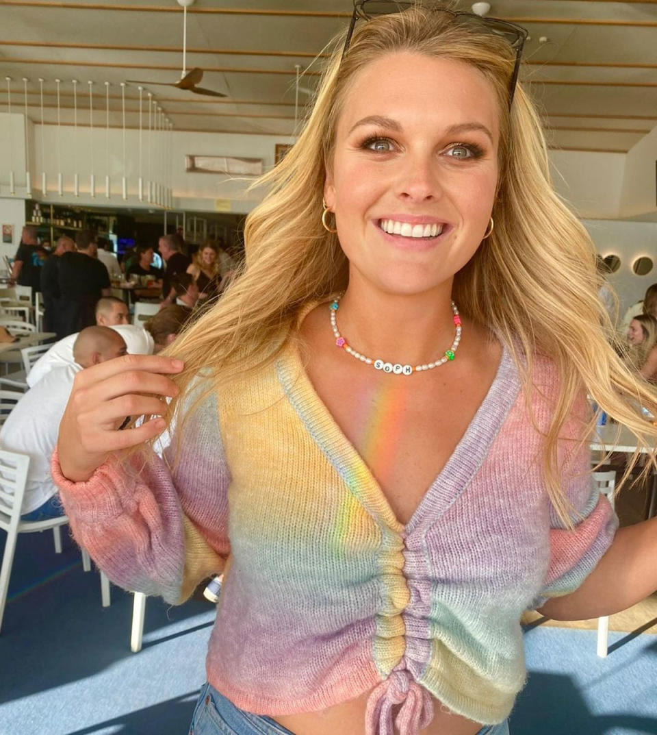 Home and Away's Sophie Dillman in a rainbow-coloured top