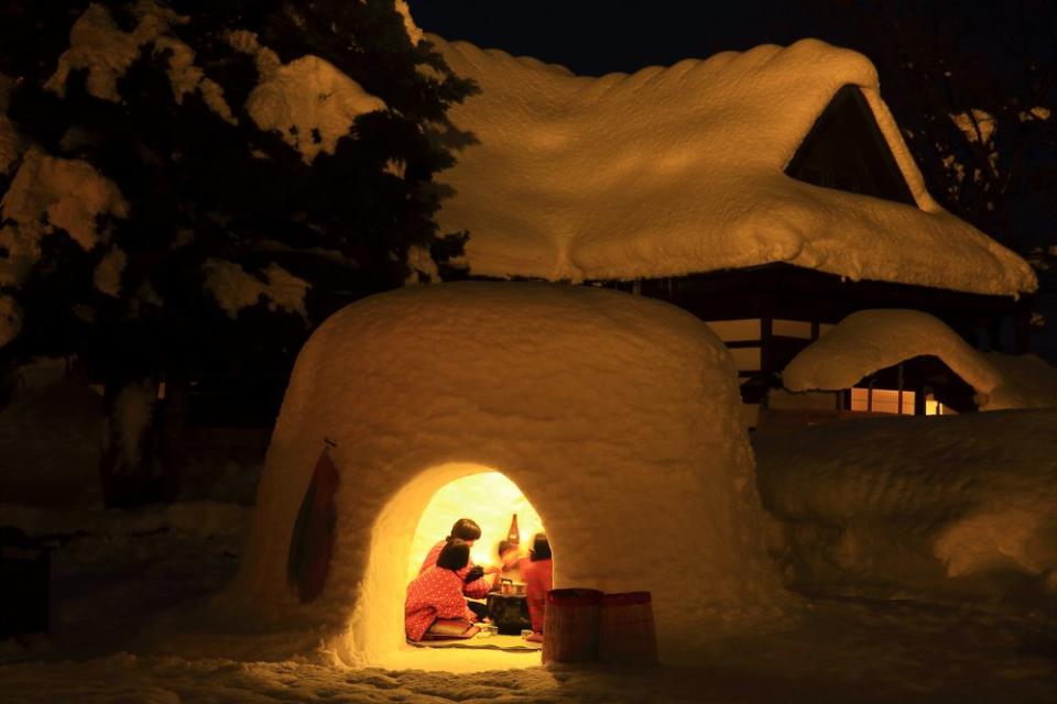 people inside a snow hut