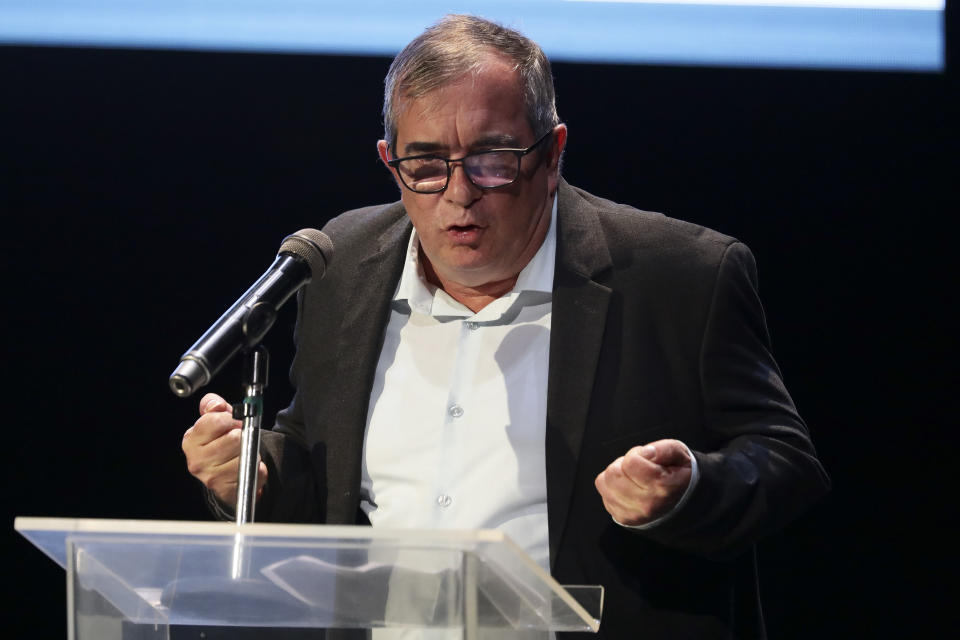 Rodrigo Londoño, also known as Timochenko, the former commander of the Revolutionary Armed Forces of Colombia, FARC, speaks during an event at the Truth Commission to commemorate victims of the country’s decades-long armed conflict, in Bogota, Colombia, Wednesday, June 23, 2021. (AP Photo/Ivan Valencia)