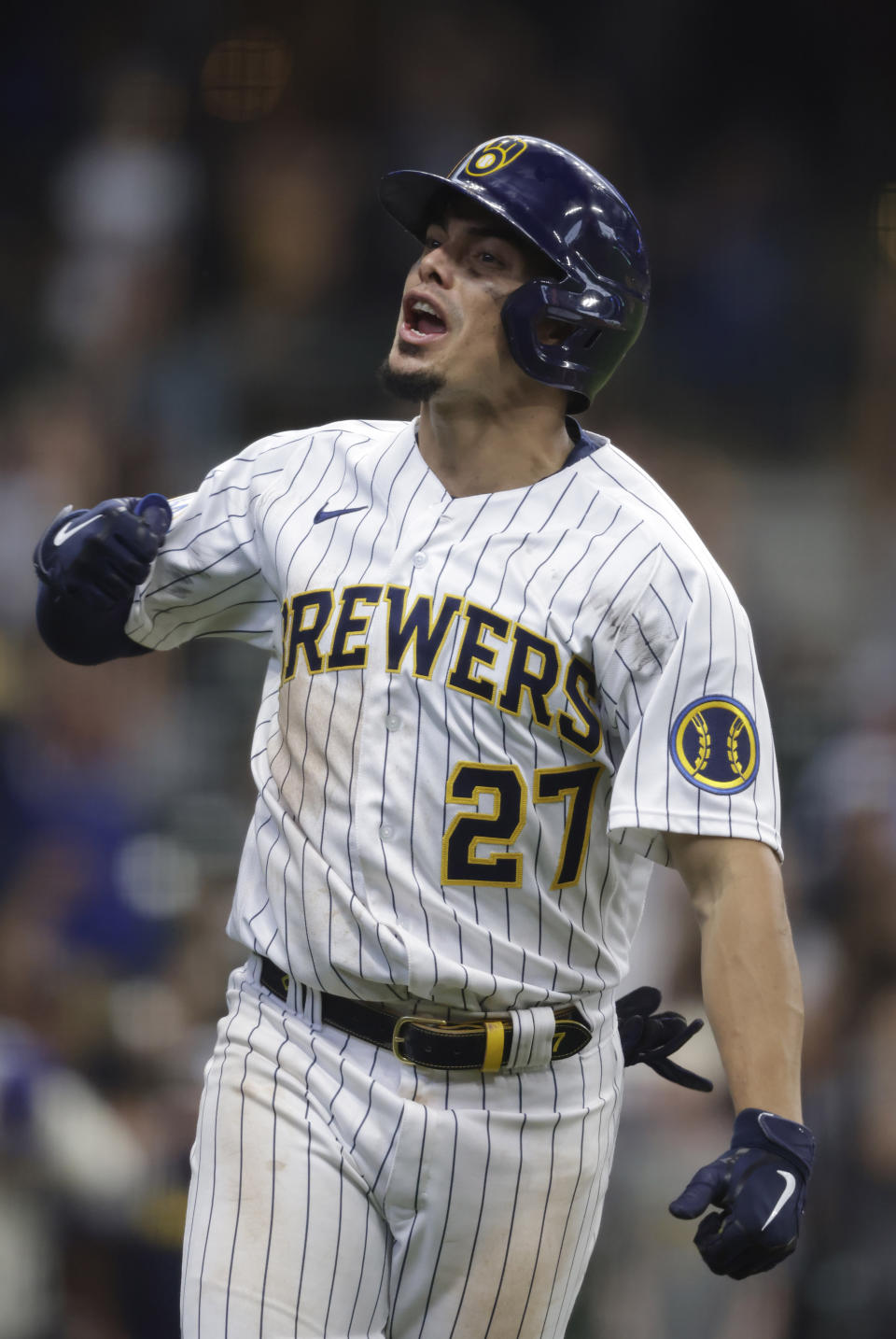 Milwaukee Brewers' Willy Adames reacts after his two-run home run during the seventh inning of a baseball game against the Colorado Rockies, Friday, June 25, 2021, in Milwaukee. (AP Photo/Jeffrey Phelps)