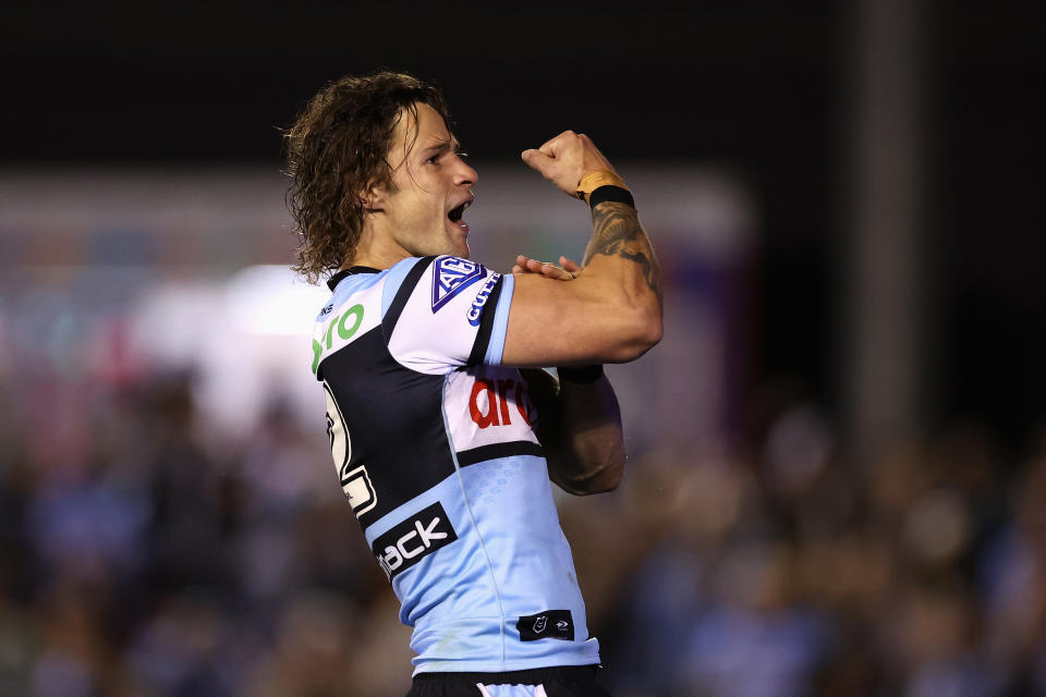 Nicho Hynes celebrates a try.