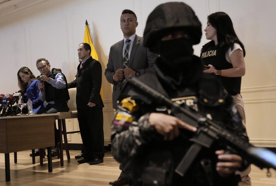 Wearing a bulletproof vest, Christian Zurita, second from left, who replaces slain presidential candidate Fernando Villavencencio, gives a press conference in Guayaquil, Ecuador, Wednesday, Aug. 16, 2023. Villavicencio was shot and killed as he was leaving a campaign rally at a school in the Ecuadorian capital, less than two weeks before the Aug. 20 presidential snap election. (AP Photo/Martin Mejia)