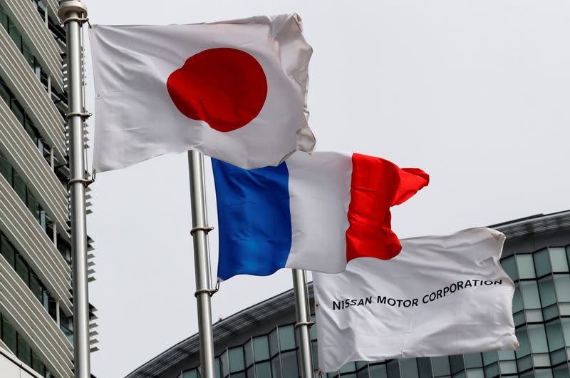 FILE PHOTO: Flags of Japan, France and Nissan are seen at Nissan Motor Co.'s global headquarters in Yokohama