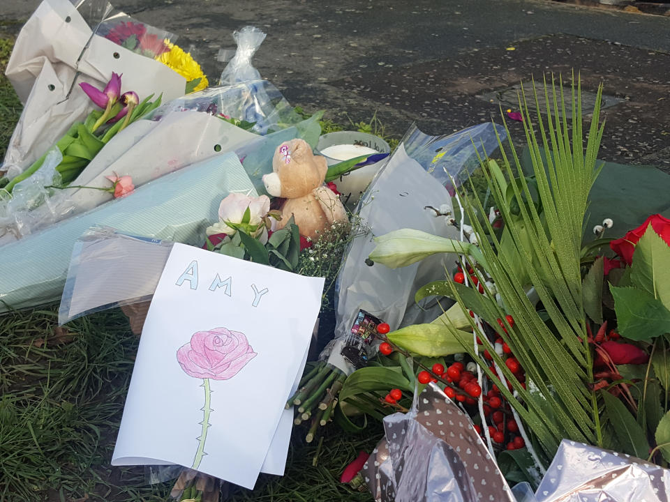 Floral tributes left for the victims in Hazel Way, Crawley Down, West Sussex. (PA)