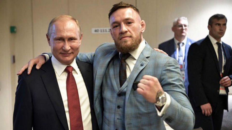 McGregor poses with the Russian leader. Pic: Getty