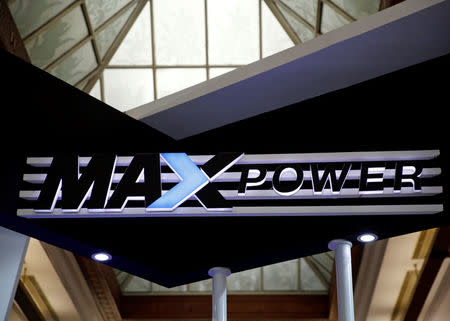 A MAXpower sign is seen above the power company's booth at an electricity exhibition show at the convention center in Jakarta, Indonesia September 28, 2016. REUTERS/Darren Whiteside