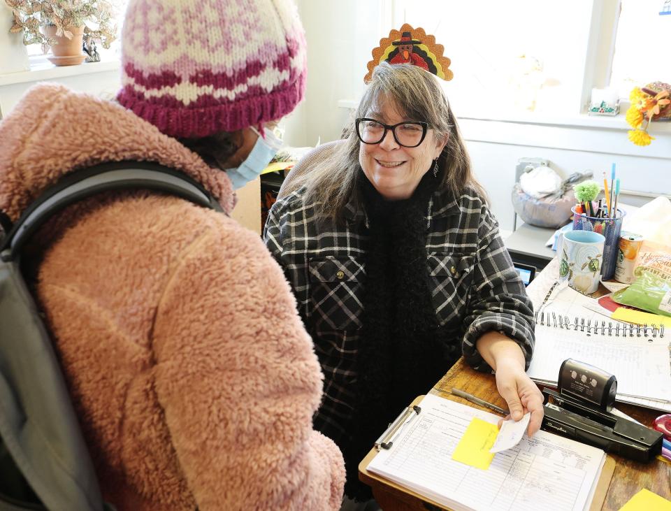 The Rev. Dr. Leslie Whited, director of Mosaic Inter-Faith Ministries, talks with a client while handing out Thanksgiving meals in Salt Lake City on Tuesday, Nov. 21, 2023. | Jeffrey D. Allred, Deseret News