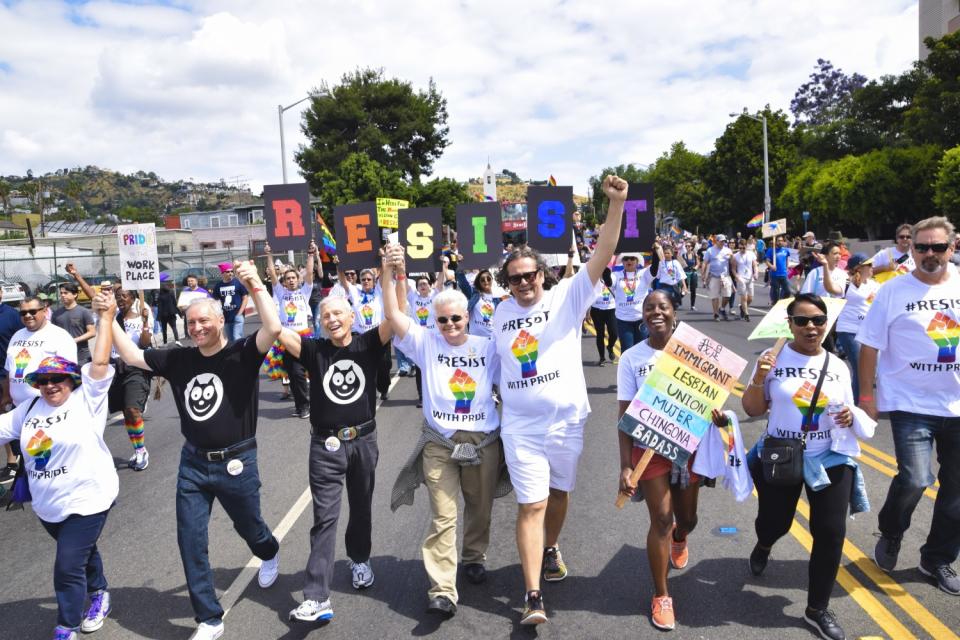 Alexei Romanoff, third from right, and his husband David Farah march in the 2017 L.A. Pride parade.