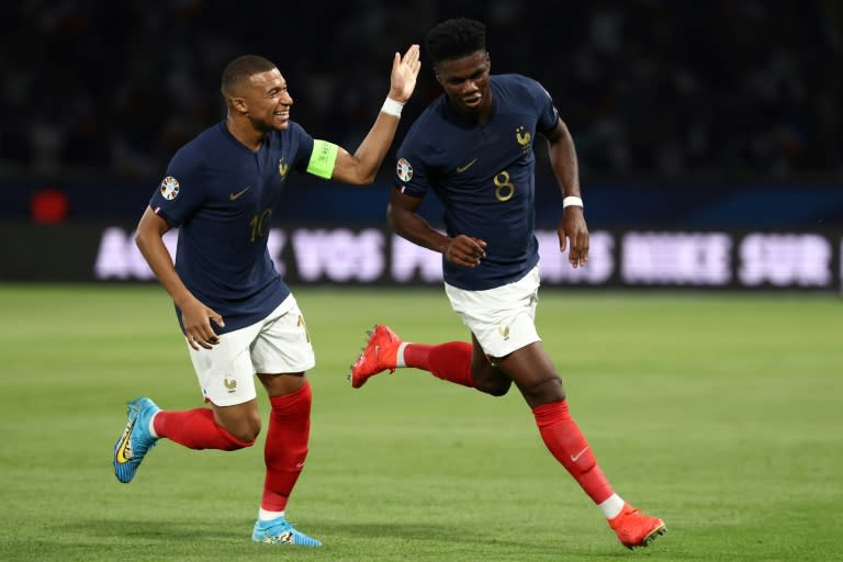 Aurelien Tchouameni celebrates with <a class="link " href="https://sports.yahoo.com/soccer/players/3893765" data-i13n="sec:content-canvas;subsec:anchor_text;elm:context_link" data-ylk="slk:Kylian Mbappe;sec:content-canvas;subsec:anchor_text;elm:context_link;itc:0">Kylian Mbappe</a> after putting <a class="link " href="https://sports.yahoo.com/soccer/teams/france/" data-i13n="sec:content-canvas;subsec:anchor_text;elm:context_link" data-ylk="slk:France;sec:content-canvas;subsec:anchor_text;elm:context_link;itc:0">France</a> ahead against Ireland (FRANCK FIFE)