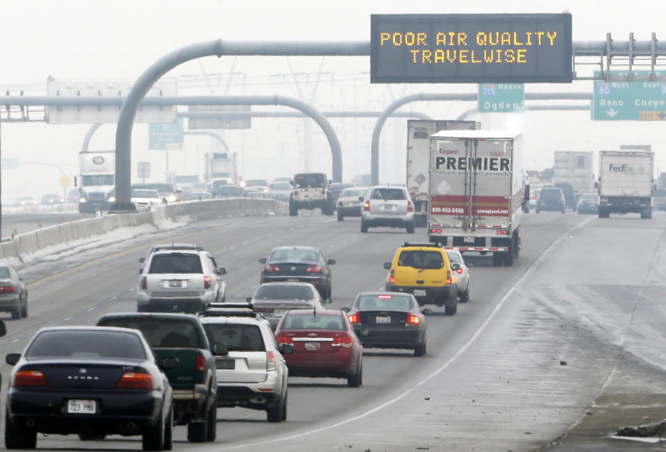 This Jan. 23, 2013, file photo, shows a poor air quality sign is posted over a highway, in Salt Lake City.  Utah's air quality improved this year, driven by more-frequent storms and new pollution controls, state environmental officials said Monday. The improved conditions came after public outcry turned up the pressure on leaders to tackle the state's air quality, which can be the worst in the country when weather conditions trap pollution in the bowl-shaped mountain basins. (Rick Bowmer / AP file)