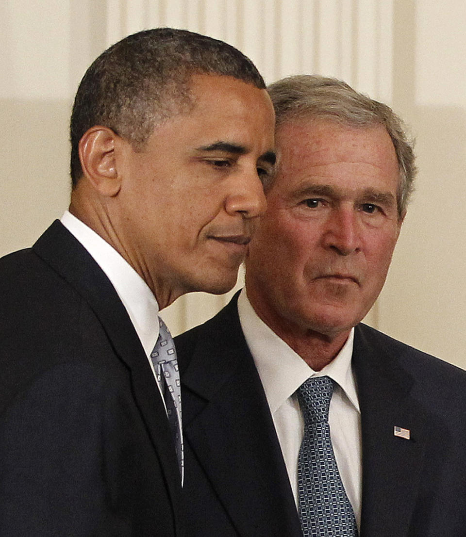 President Barack Obama and former President George W. Bush take part in a ceremony in the East Room of the White House in Washington, Thursday, May 31, 2012, to unveil the Bush portrait. (AP Photo/Pablo Martinez Monsivais)