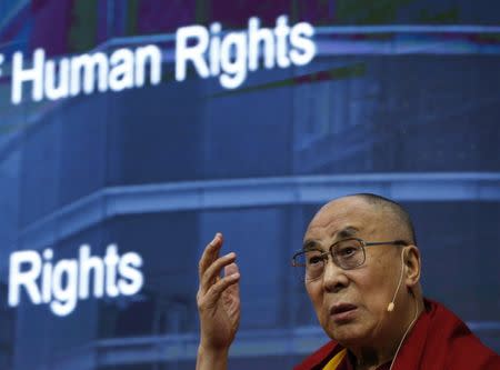 Tibetan spiritual leader the Dalai Lama addresses a panel discussion on Human Rights on the sides of the United Nations Human Rights Council in Geneva, Switzerland, March 11, 2016. REUTERS/Denis Balibouse