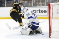 Feb 28, 2019; Boston, MA, USA; Boston Bruins left wing Brad Marchand (63) scores a goal past Tampa Bay Lightning goaltender Louis Domingue (70) during the third period at TD Garden. Mandatory Credit: Greg M. Cooper-USA TODAY Sports