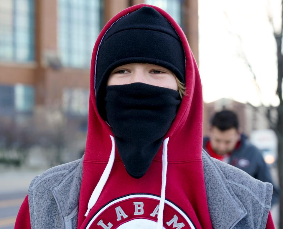 Grant Martinez, an Alabama fan from Birmingham, bundles up against the cold outside Lucas Oil Stadium in Indianapolis before the 2022 college football national championship game. The Tuscaloosa area is expected to have a wind chill factor below zero on Friday as an arctic mass moves into Alabama. 
(Photo: Gary Cosby Jr., Gary Cosby Jr.-USA TODAY Sports)