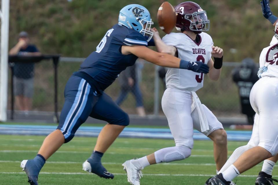 Central Valley linebacker Ethan Shearer (6) hits Beaver Area quarterback Travis Clear (3) in the first quarter to force a fumble in the Warriros Western Hills Conference game at Sarge Alberts Stadium Friday night.