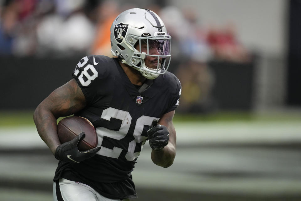 Josh Jacobs held out this preseason after he declined to sign the franchise tag the Raiders tried to place on him.