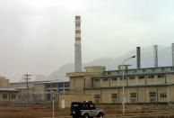 FILE PHOTO: A security car passes in front of the Natanz nuclear facility 300 km south of Tehran Novem..