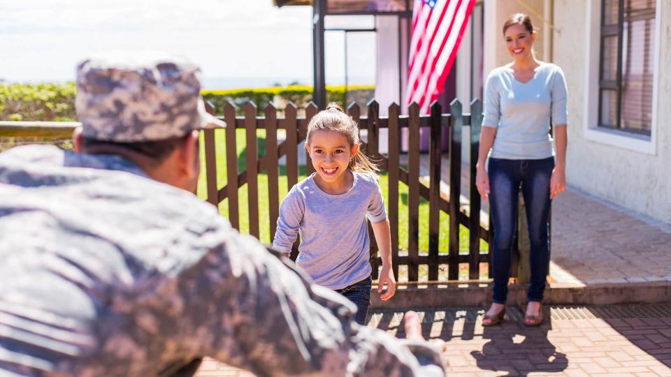 happy young american military family reunion.