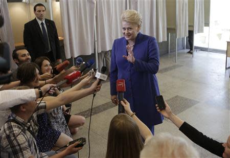 Lithuania's President Dalia Grybauskaite speaks to the media at a polling station during European Parliament and Lithuania's presidential elections in Vilnius May 25, 2014. REUTERS/Ints Kalnins
