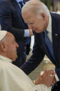 Pope Francis, left, greets U.S. President Joe Biden during a working session on AI, Energy, Africa and Mideast at the G7 summit, in Borgo Egnazia, near Bari in southern Italy, Friday, June 14, 2024. (AP Photo/Andrew Medichini)