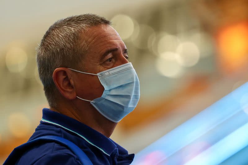 Belarus' athletics head coach Yuri Moisevich and team official Artur Shumak at Haneda Airport in Tokyo