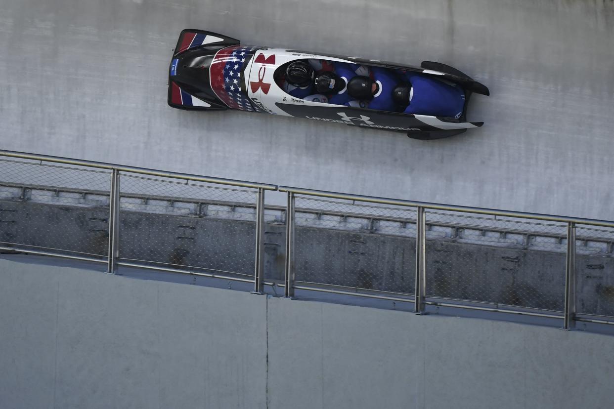 USA's Codie Bascue, Adrian Adams, Boone Niederhofer and Kyle Wilcox compete in the 4-man bobsleigh during the IBSF Sanctioned Race, part of a 2022 Beijing Winter Olympic Games test event, at the Yanqing National Sliding Center in Beijing on October 26, 2021. (Photo by WANG Zhao / AFP) (Photo by WANG ZHAO/AFP via Getty Images)