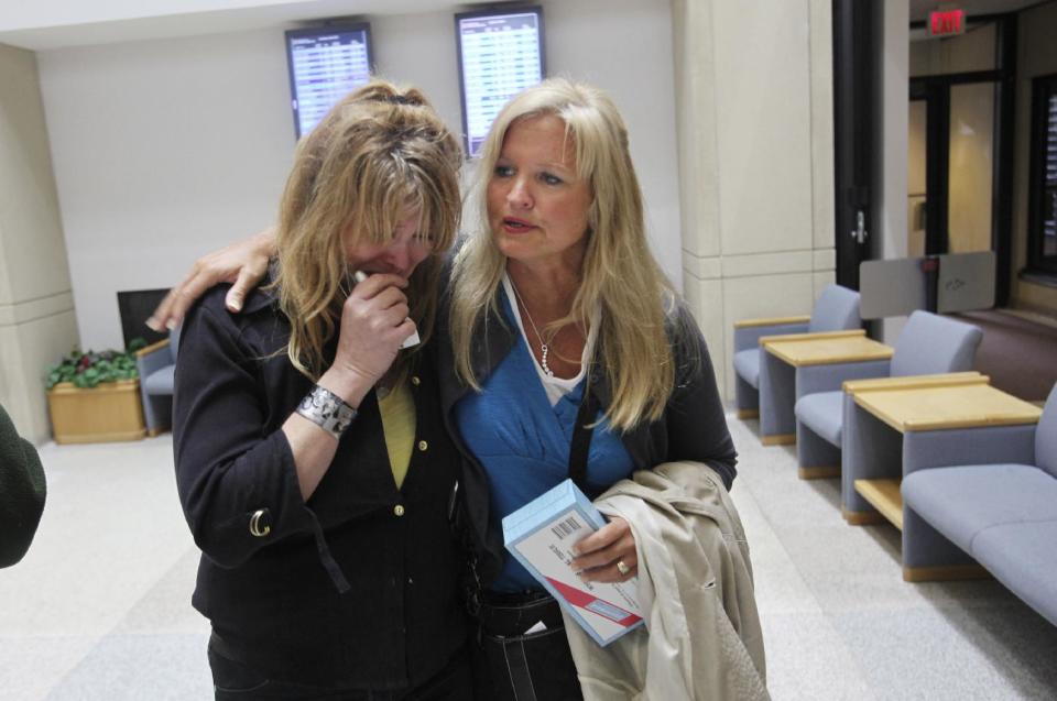 Jill Robinson, left, is comforted by her sister Wendy Hatchner at the Anoka County Courthouse, Thursday, March 22, 2012, in Anoka, Minn. Robinson's son Trevor died after taking the synthetic drug, supplied by Timothy LaMare. Twenty-two-year-old Timothy LaMere pleaded guilty Thursday in Anoka County he'll receive nine years, nine months in prison when he's sentenced May 25. (AP Photo/The Star Tribune, David Joles) MANDATORY CREDIT; ST. PAUL PIONEER PRESS OUT; MAGS OUT; TWIN CITIES TV OUT