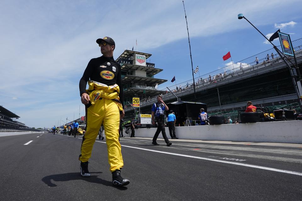 Scott McLaughlin, of New Zealand, walks to his pit box during a practice session for the Indianapolis 500 auto race at Indianapolis Motor Speedway, Monday, May 20, 2024, in Indianapolis. (AP Photo/Darron Cummings)