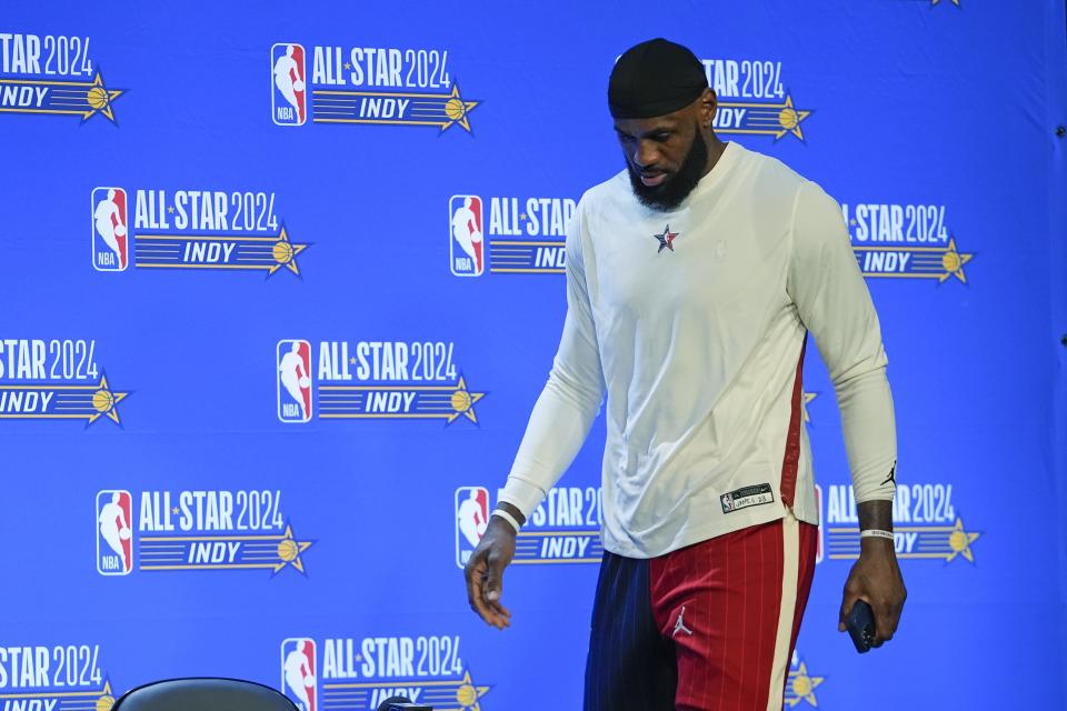 Los Angeles Lakers' LeBron James walks to the podium for a news conference before the NBA basketball All-Star game, Sunday, Feb. 18, 2024, in Indianapolis. (AP Photo/Darron Cummings)