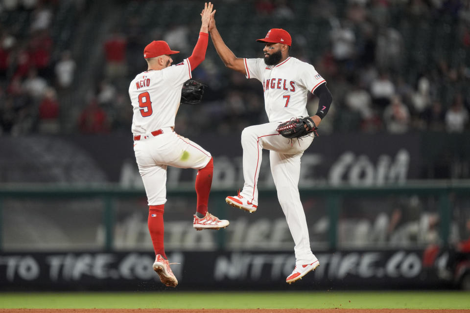 Los Angeles Angels shortstop Zach Neto, left, and right fielder Jo Adell celebrate the team's win in a baseball game against the Detroit Tigers, Thursday, June 27, 2024, in Anaheim, Calif. (AP Photo/Ryan Sun)