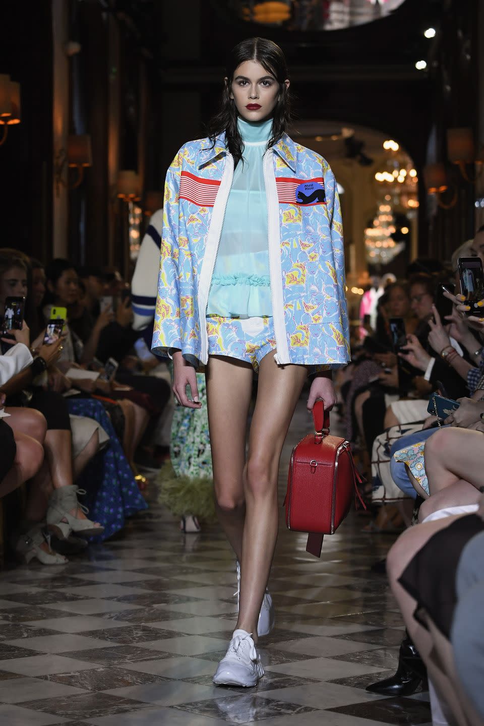 <p>The 16-year-old looked effortlessly cool in a blue Miu Miu ensemble for the brand's Cruise collection show in Paris, June 2018</p>