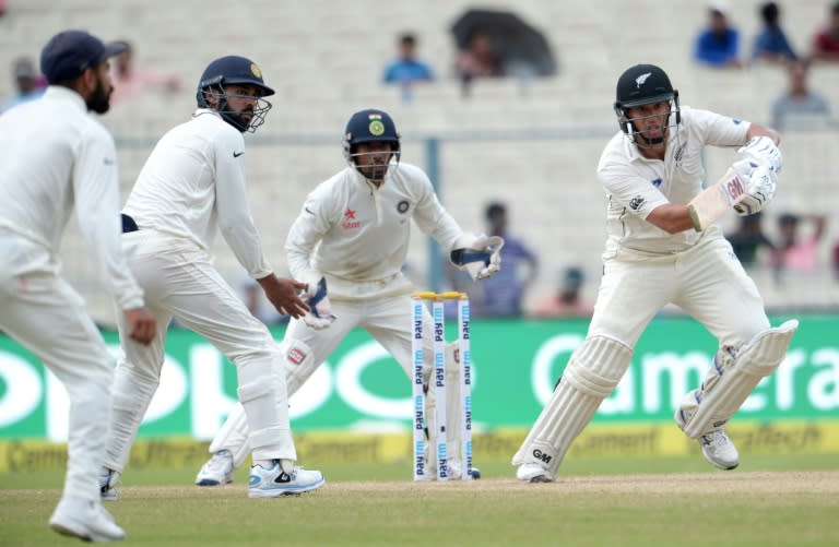 New Zealand's Ross Taylor (right) plays a shot during the second day of the second Test match between India and New Zealand at the Eden Gardens in Kolkata, on October 1, 2016