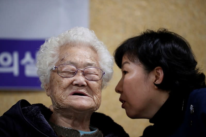 Former South Korean "comfort woman" Lee Ok-sun attends a news conference in Seoul