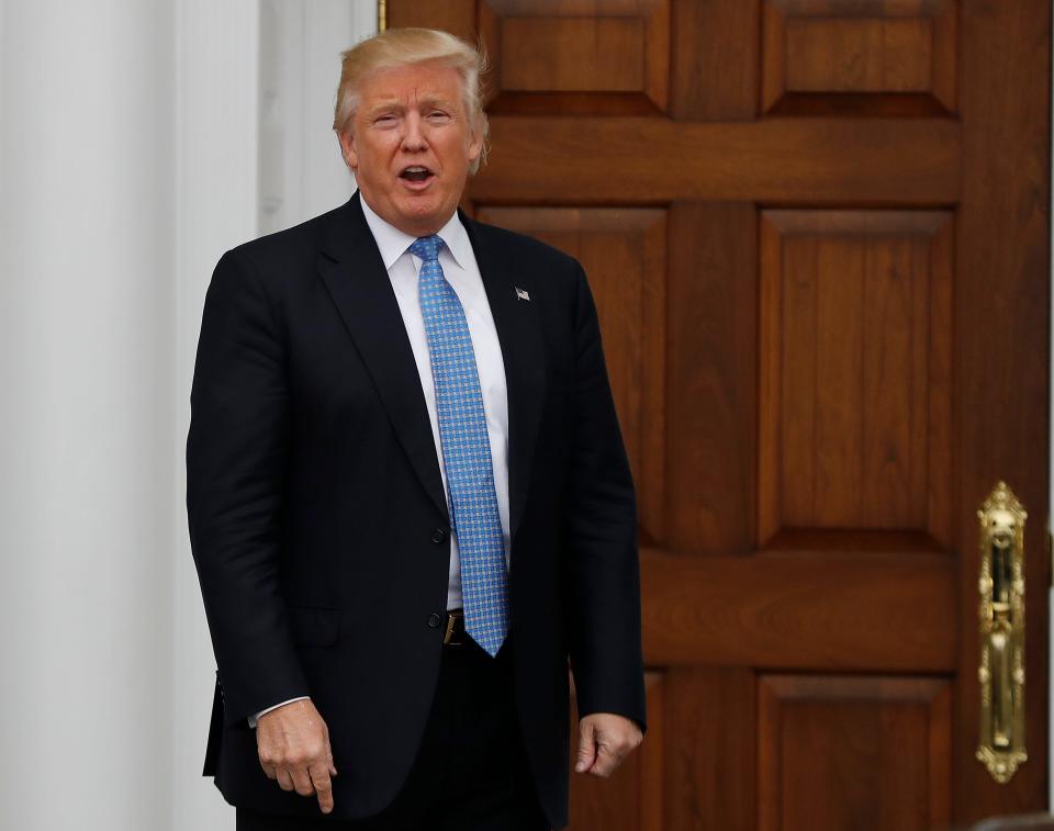 Donald Trump at the entryway of Trump National Golf Club Bedminster clubhouse in 2016.