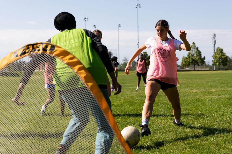 Sutton Hull, of Park City, shoots the soccer ball during a scrimmage at a #SheBelongs soccer practice at Lone Peak Park in Sandy on Thursday, July 6, 2023. #SheBelongs is a four-month program bringing together refugee and nonrefugee girls through soccer. | Megan Nielsen, Deseret News