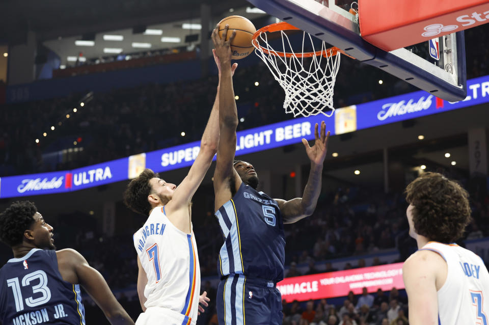 Dec 18, 2023; Oklahoma City, Oklahoma, USA; Memphis Grizzlies guard <a class="link " href="https://sports.yahoo.com/nba/players/6737" data-i13n="sec:content-canvas;subsec:anchor_text;elm:context_link" data-ylk="slk:Vince Williams Jr.;sec:content-canvas;subsec:anchor_text;elm:context_link;itc:0">Vince Williams Jr.</a> (5) shoots as Oklahoma City Thunder forward Chet Holmgren (7) defends during the second half at Paycom Center. Mandatory Credit: Alonzo Adams-USA TODAY Sports