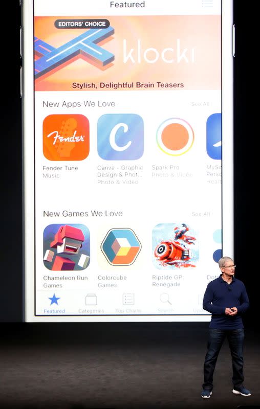 FILE PHOTO: Apple's CEO, Cook, discusses the App Store during an Apple media event in San Francisco