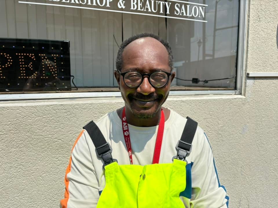 Keith Mack of Petersburg strikes a pose along N. Sycamore Street during a heat wave in Petersburg on July 16, 2024.