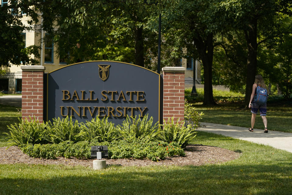 A student enters the campus of Ball State University in Muncie, Ind., Thursday, Sept. 10, 2020. College towns across the U.S. have emerged as coronavirus hot spots in recent weeks as schools struggle to contain the virus. Out of nearly 600 students tested for the virus at Ball State, more than half have returned been found positive, according to data reported by the school. Dozens of infections have been blamed on off-campus parties, prompting university officials to admonish students. (AP Photo/Michael Conroy)