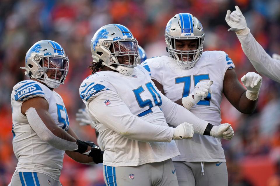 Detroit Lions nose tackle Alim McNeill (54) celebrates after sacking Denver Broncos quarterback Teddy Bridgewater (5) during the first half of an NFL football game, Sunday, Dec. 12, 2021, in Denver.