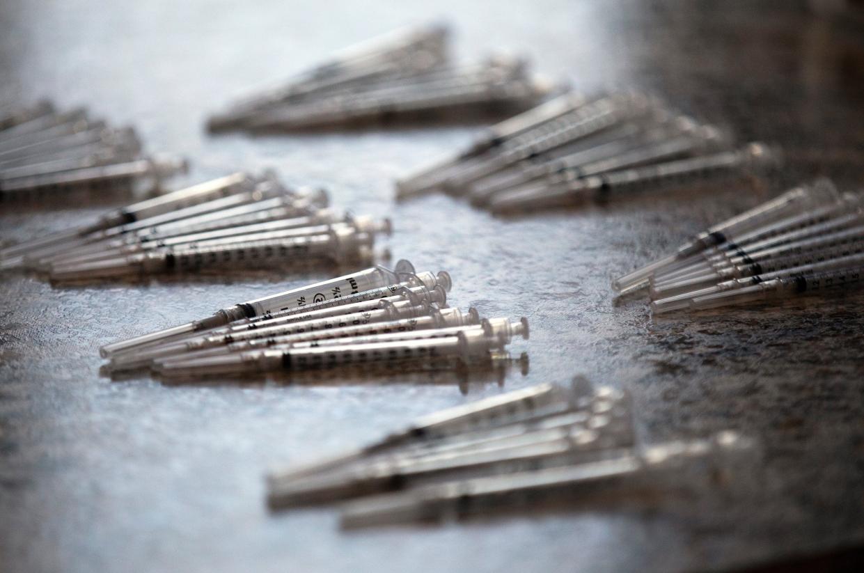 Syringes that will be used with the Pfizer-BioNTech COVID-19 vaccine are at the ready at Corinthian Baptist Church in Cincinnati.