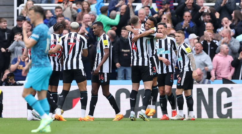   Newcastle players celebrate after one of their goals against Tottenham in the Premier League in April 2023. 