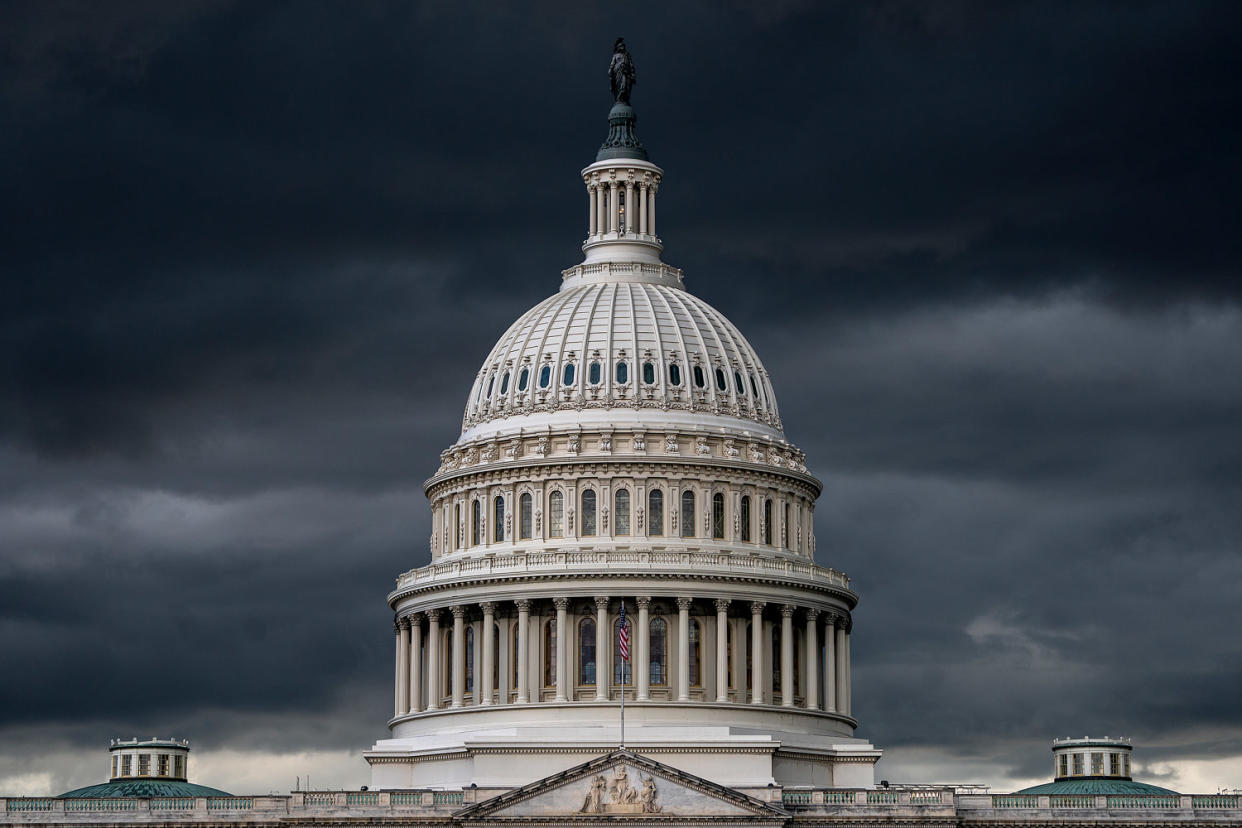 Storm clouds darken the skies above the Capitol (J. Scott Applewhite / AP file)