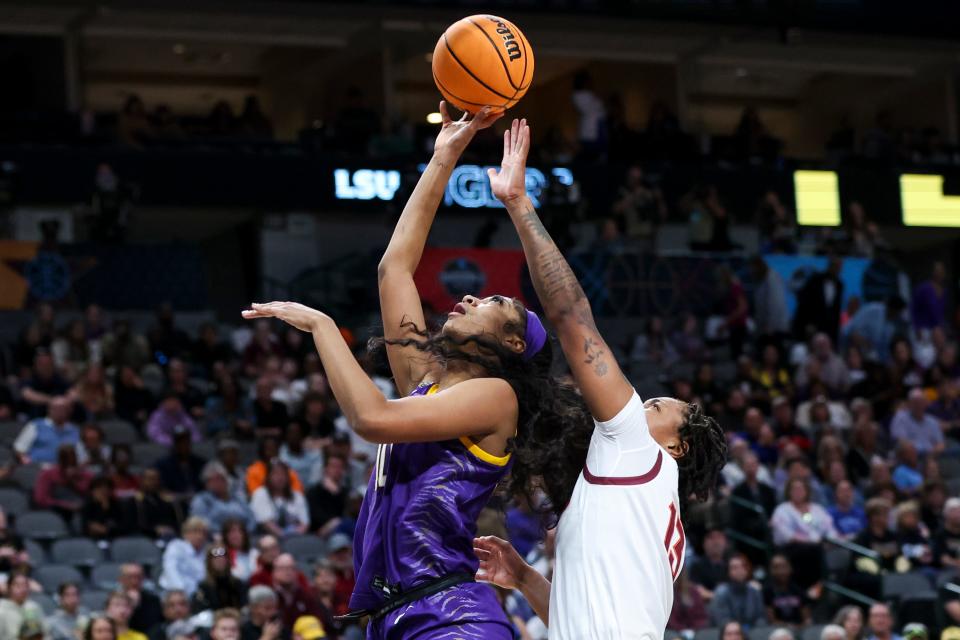 Mar 31, 2023; Dallas, TX, USA; LSU Lady Tigers forward Angel Reese (10) drives to the basket against Virginia Tech Hokies forward Taylor Soule (13) in the first half in semifinals of the the women's Final Four of the 2023 NCAA Tournament at American Airlines Center. Mandatory Credit: Kevin Jairaj-USA TODAY Sports