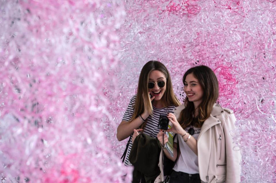 Two girls visit the installation 'Limbo' at the University of Milan on April 16, 2018 in Milan, Italy. (Photo: Emanuele Cremaschi/Getty Images)