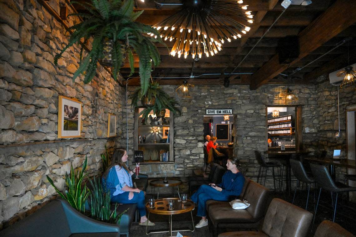 Drastic Measures is located in an 1,100-square-foot room in a Shawnee stone building that dates to the 1850s. Faryle Barthuly, left, of Lenexa, and Reilly Oliver of Westwood Hills met there for drinks over happy hour.