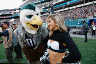 <p>Swoop, Philadelphia Eagles mascot talks with a cheerleader against the Denver Broncos during the fourth quarter at Lincoln Financial Field on November 5, 2017 in Philadelphia, Pennsylvania. The Philadelphia Eagles won 51-23. (Photo by Joe Robbins/Getty Images) </p>